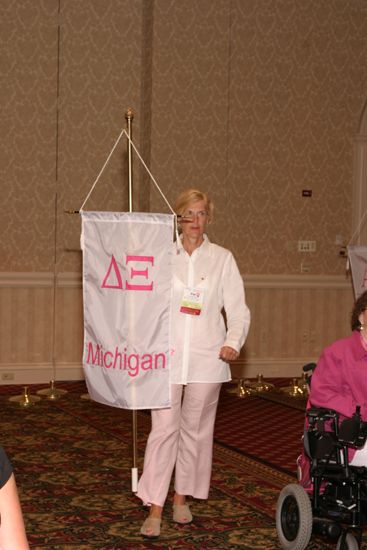 Unidentified Phi Mu With Delta Xi Chapter Banner in Convention Parade of Flags Photograph, July 9, 2004 (image)