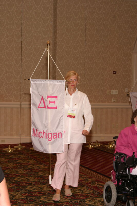 Unidentified Phi Mu With Delta Xi Chapter Banner in Convention Parade of Flags Photograph, July 9, 2004 (Image)