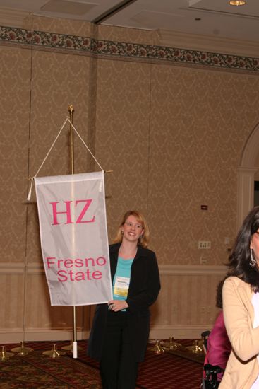 Unidentified Phi Mu With Eta Zeta Chapter Banner in Convention Parade of Flags Photograph, July 9, 2004 (image)