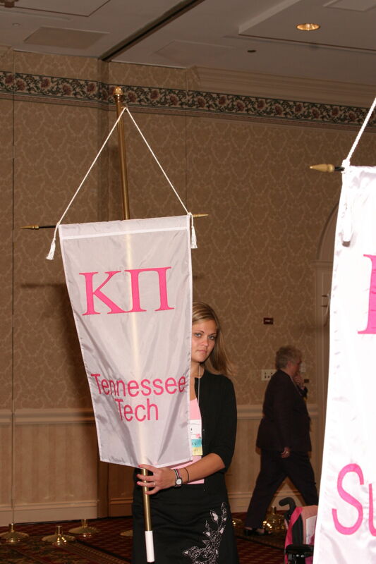 Unidentified Phi Mu With Kappa Pi Chapter Banner in Convention Parade of Flags Photograph, July 9, 2004 (Image)