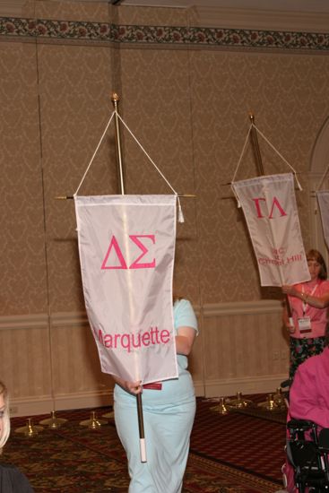 Unidentified Phi Mu With Delta Sigma Chapter Banner in Convention Parade of Flags Photograph, July 9, 2004 (image)