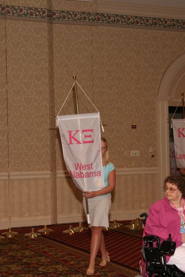 Unidentified Phi Mu With Kappa Xi Chapter Banner in Convention Parade of Flags Photograph, July 9, 2004 (image)