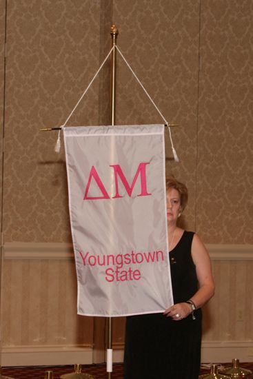 Unidentified Phi Mu With Delta Mu Chapter Banner in Convention Parade of Flags Photograph, July 9, 2004 (image)