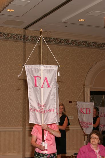 Unidentified Phi Mu With Gamma Lambda Chapter Banner in Convention Parade of Flags Photograph, July 9, 2004 (image)