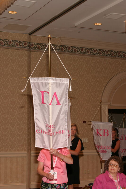 Unidentified Phi Mu With Gamma Lambda Chapter Banner in Convention Parade of Flags Photograph, July 9, 2004 (Image)
