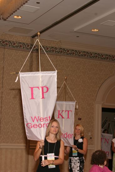 Amber Aiken With Gamma Rho Chapter Banner in Convention Parade of Flags Photograph, July 9, 2004 (image)