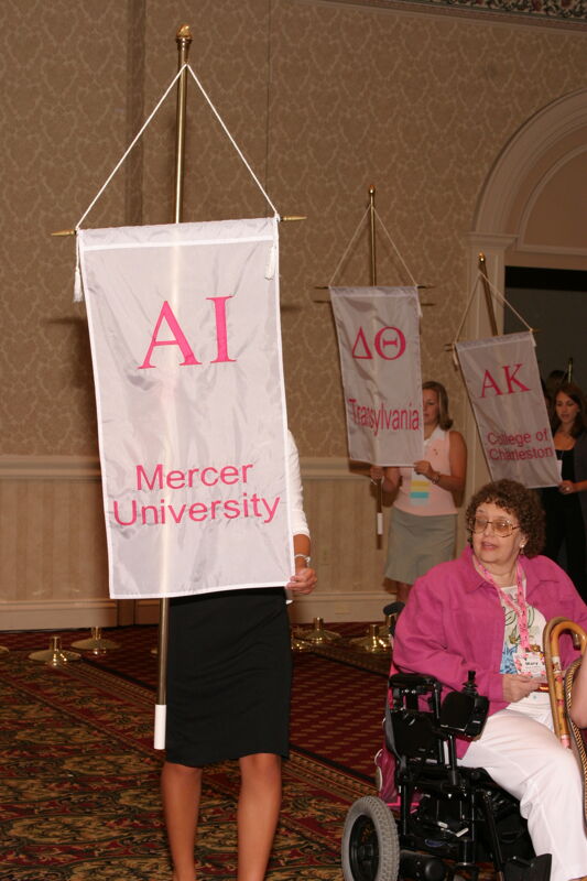 Unidentified Phi Mu With Alpha Iota Chapter Banner in Convention Parade of Flags Photograph, July 9, 2004 (Image)