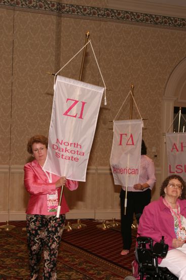 Unidentified Phi Mu With Zeta Iota Chapter Banner in Convention Parade of Flags Photograph, July 9, 2004 (image)