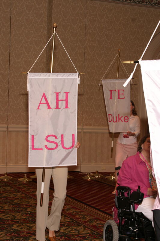 Unidentified Phi Mu With Alpha Eta Chapter Banner in Convention Parade of Flags Photograph, July 9, 2004 (Image)