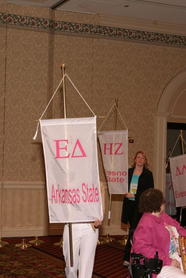 Unidentified Phi Mu With Epsilon Delta Chapter Banner in Convention Parade of Flags Photograph, July 9, 2004 (image)