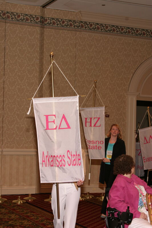 Unidentified Phi Mu With Epsilon Delta Chapter Banner in Convention Parade of Flags Photograph, July 9, 2004 (Image)