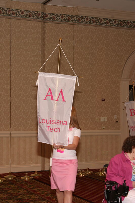 Unidentified Phi Mu With Alpha Lambda Chapter Banner in Convention Parade of Flags Photograph, July 9, 2004 (Image)