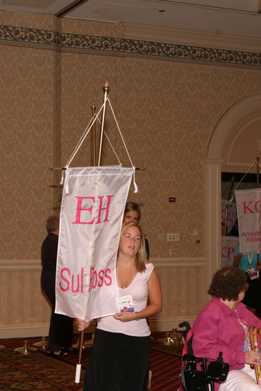 Julie Binder With Epsilon Eta Chapter Banner in Convention Parade of Flags Photograph, July 9, 2004 (Image)