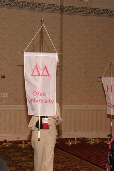 Ali Kearns With Delta Delta Chapter Banner in Convention Parade of Flags Photograph, July 9, 2004 (image)