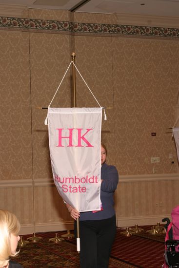 Unidentified Phi Mu With Eta Kappa Chapter Banner in Convention Parade of Flags Photograph, July 9, 2004 (image)