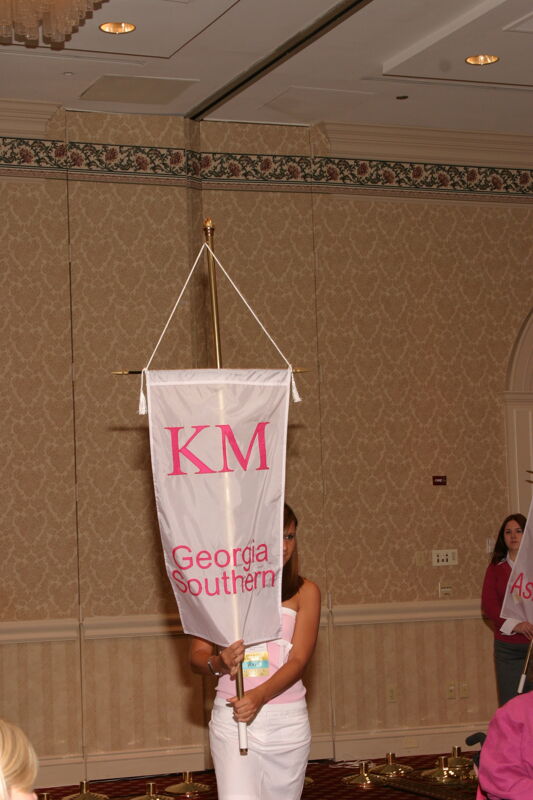 Unidentified Phi Mu With Kappa Mu Chapter Banner in Convention Parade of Flags Photograph, July 9, 2004 (Image)