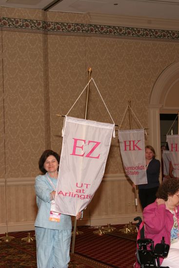 Unidentified Phi Mu With Epsilon Zeta Chapter Banner in Convention Parade of Flags Photograph, July 9, 2004 (image)