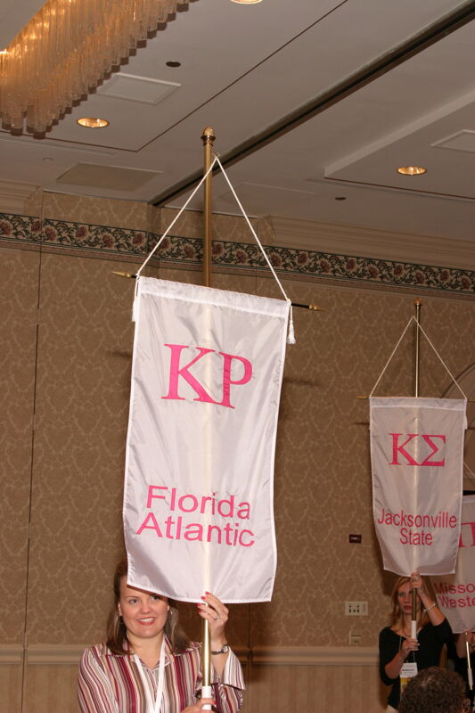 Unidentified Phi Mu With Kappa Rho Chapter Banner in Convention Parade of Flags Photograph 2, July 9, 2004 (Image)