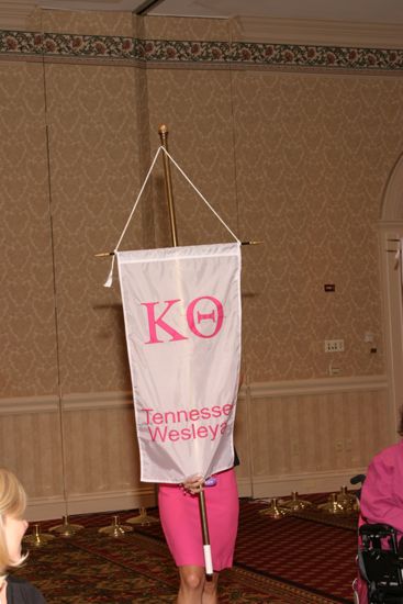 Unidentified Phi Mu With Kappa Theta Chapter Banner in Convention Parade of Flags Photograph, July 9, 2004 (image)