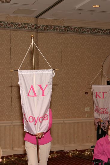 Unidentified Phi Mu With Delta Upsilon Chapter Banner in Convention Parade of Flags Photograph, July 9, 2004 (image)