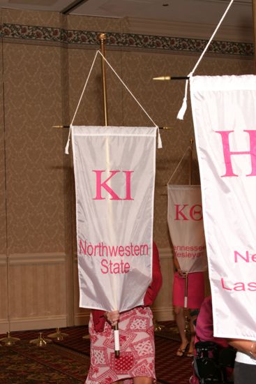 Unidentified Phi Mu With Kappa Iota Chapter Banner in Convention Parade of Flags Photograph, July 9, 2004 (image)