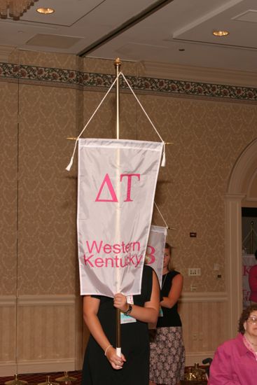 Unidentified Phi Mu With Delta Tau Chapter Banner in Convention Parade of Flags Photograph, July 9, 2004 (image)