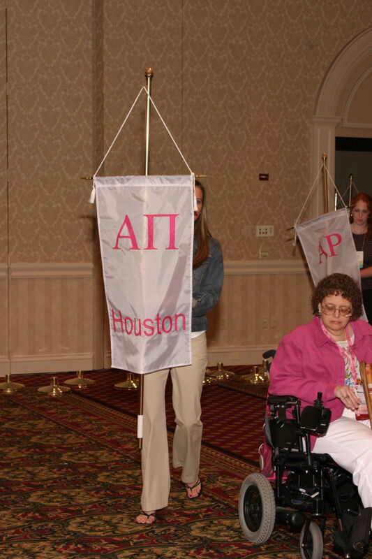 Unidentified Phi Mu With Alpha Pi Chapter Banner in Convention Parade of Flags Photograph, July 9, 2004 (Image)