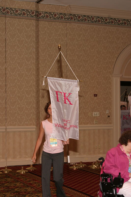 Unidentified Phi Mu With Gamma Kappa Chapter Banner in Convention Parade of Flags Photograph, July 9, 2004 (Image)