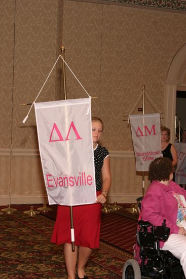 Unidentified Phi Mu With Delta Lambda Chapter Banner in Convention Parade of Flags Photograph, July 9, 2004 (image)