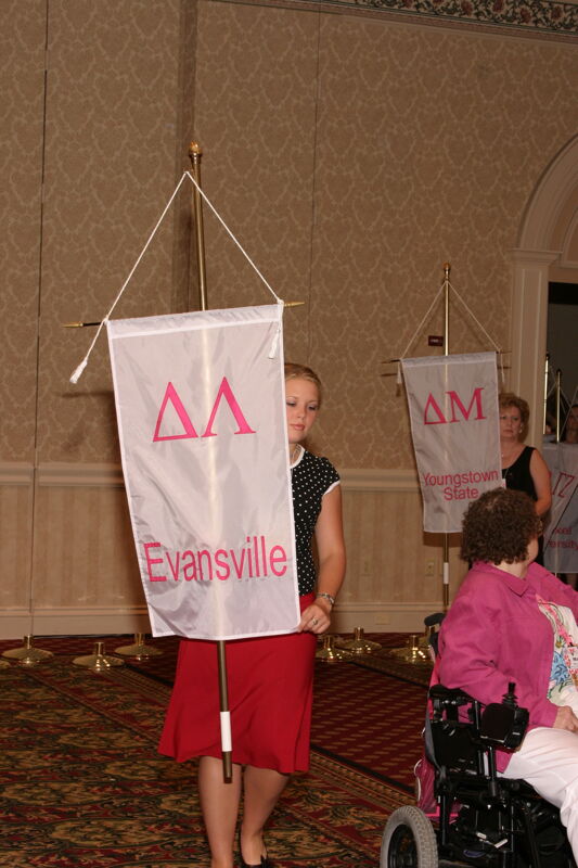 Unidentified Phi Mu With Delta Lambda Chapter Banner in Convention Parade of Flags Photograph, July 9, 2004 (Image)