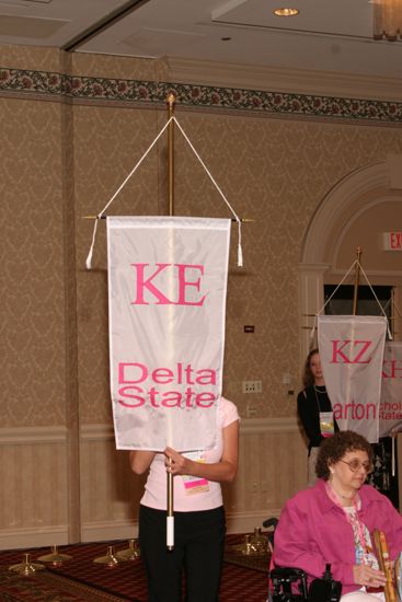 Unidentified Phi Mu With Kappa Epsilon Chapter Banner in Convention Parade of Flags Photograph, July 9, 2004 (image)