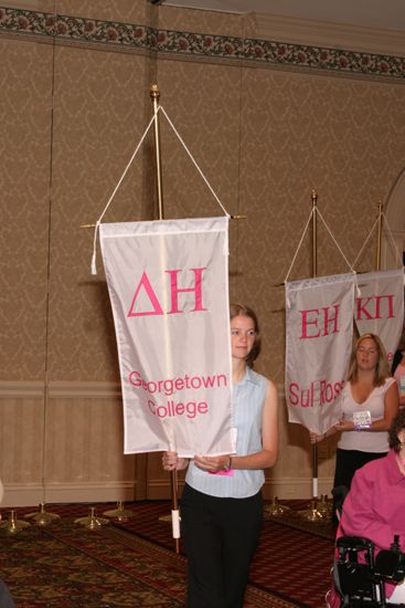 Unidentified Phi Mu With Delta Eta Chapter Banner in Convention Parade of Flags Photograph, July 9, 2004 (image)