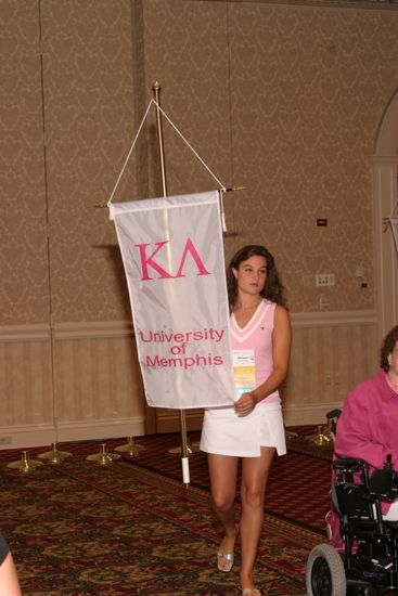 Allison Vaughn With Kappa Lambda Chapter Banner in Convention Parade of Flags Photograph, July 9, 2004 (image)