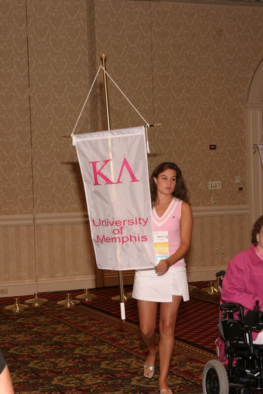 Allison Vaughn With Kappa Lambda Chapter Banner in Convention Parade of Flags Photograph, July 9, 2004 (Image)