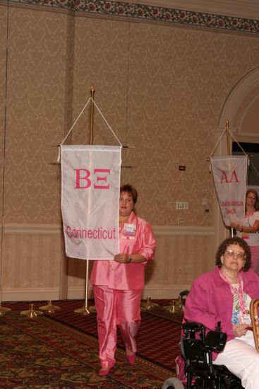 Becky School With Beta Xi Chapter Banner in Convention Parade of Flags Photograph, July 9, 2004 (image)