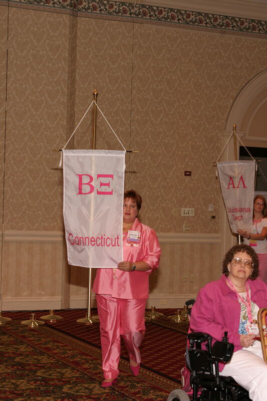 Becky School With Beta Xi Chapter Banner in Convention Parade of Flags Photograph, July 9, 2004 (Image)