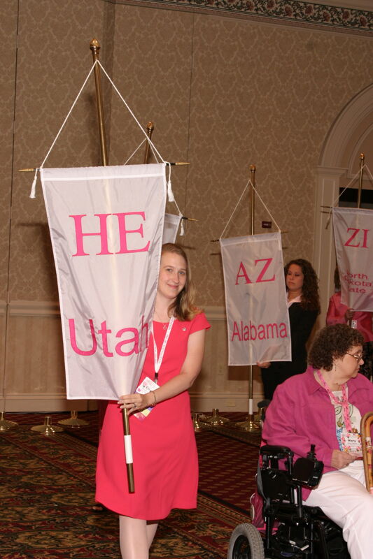 Unidentified Phi Mu With Eta Epsilon Chapter Banner in Convention Parade of Flags Photograph, July 9, 2004 (Image)
