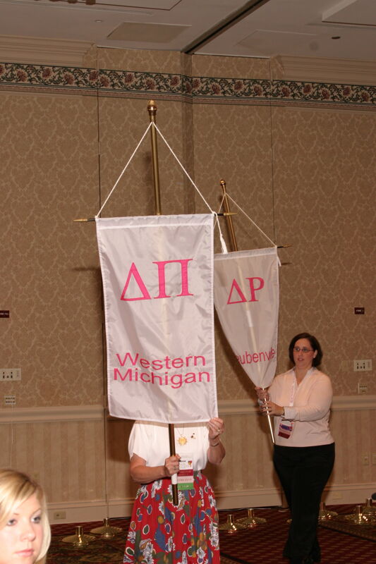 Unidentified Phi Mu With Delta Pi Chapter Banner in Convention Parade of Flags Photograph, July 9, 2004 (Image)