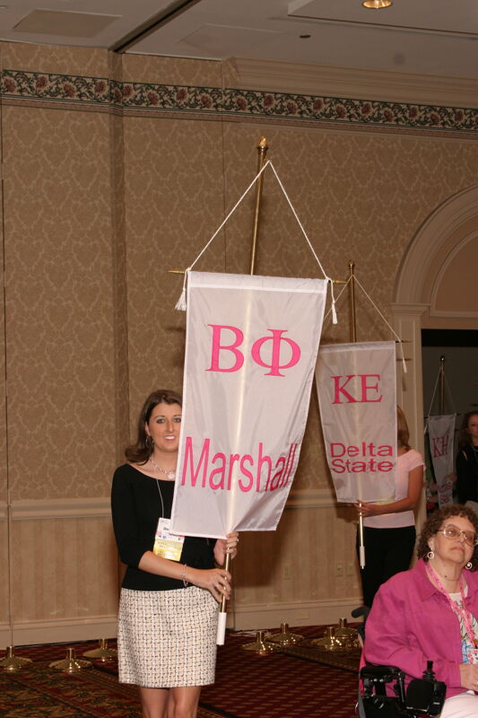 Unidentified Phi Mu With Beta Phi Chapter Banner in Convention Parade of Flags Photograph, July 9, 2004 (Image)
