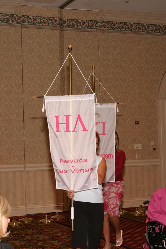 Unidentified Phi Mu With Eta Lambda Chapter Banner in Convention Parade of Flags Photograph, July 9, 2004 (Image)