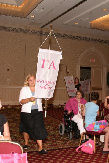 Unidentified Phi Mu With Gamma Alpha Chapter Banner in Convention Parade of Flags Photograph, July 9, 2004 (image)