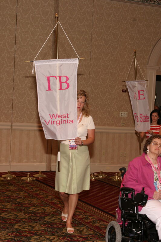 Molly Williams With Gamma Beta Chapter Banner in Convention Parade of Flags Photograph, July 9, 2004 (Image)