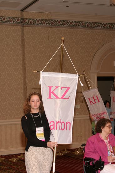 Heather Caputo With Kappa Zeta Chapter Banner in Convention Parade of Flags Photograph, July 9, 2004 (image)