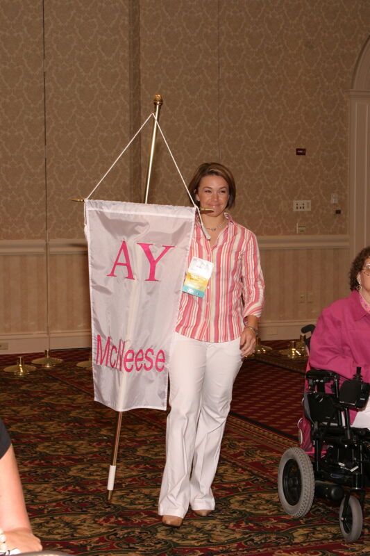 Unidentified Phi Mu With Alpha Upsilon Chapter Banner in Convention Parade of Flags Photograph, July 9, 2004 (Image)
