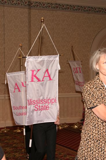 Unidentified Phi Mu With Kappa Alpha Chapter Banner in Convention Parade of Flags Photograph, July 9, 2004 (image)