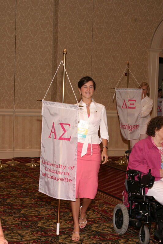 Unidentified Phi Mu With Alpha Sigma Chapter Banner in Convention Parade of Flags Photograph, July 9, 2004 (Image)