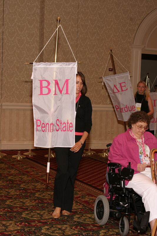 Unidentified Phi Mu With Beta Mu Chapter Banner in Convention Parade of Flags Photograph, July 9, 2004 (Image)