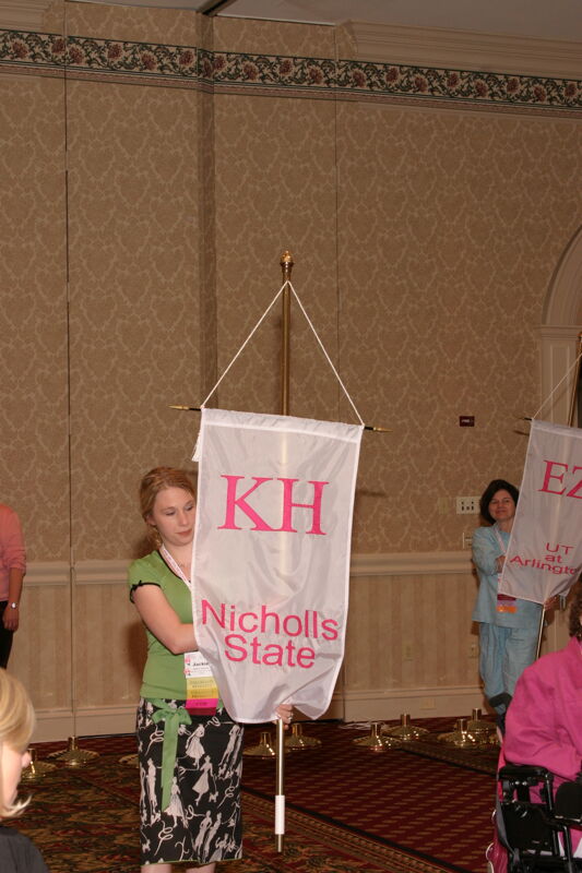 Jackie Johnson With Kappa Eta Chapter Banner in Convention Parade of Flags Photograph, July 9, 2004 (Image)