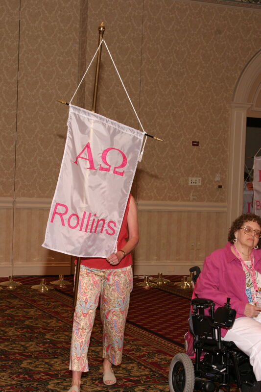 Unidentified Phi Mu With Alpha Omega Chapter Banner in Convention Parade of Flags Photograph, July 9, 2004 (Image)