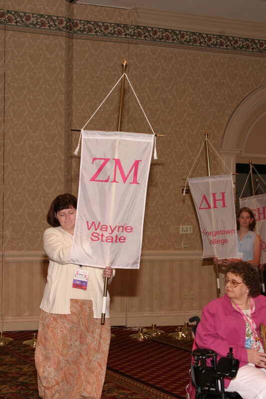 Unidentified Phi Mu With Zeta Mu Chapter Banner in Convention Parade of Flags Photograph, July 9, 2004 (Image)